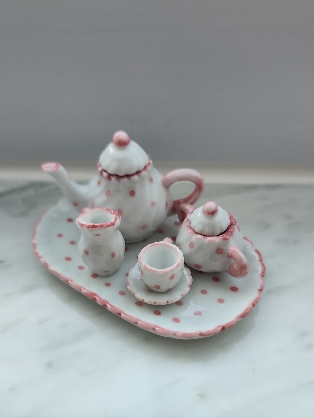 Hallmark miniature tea set featuring white porcelain with pink polka dots